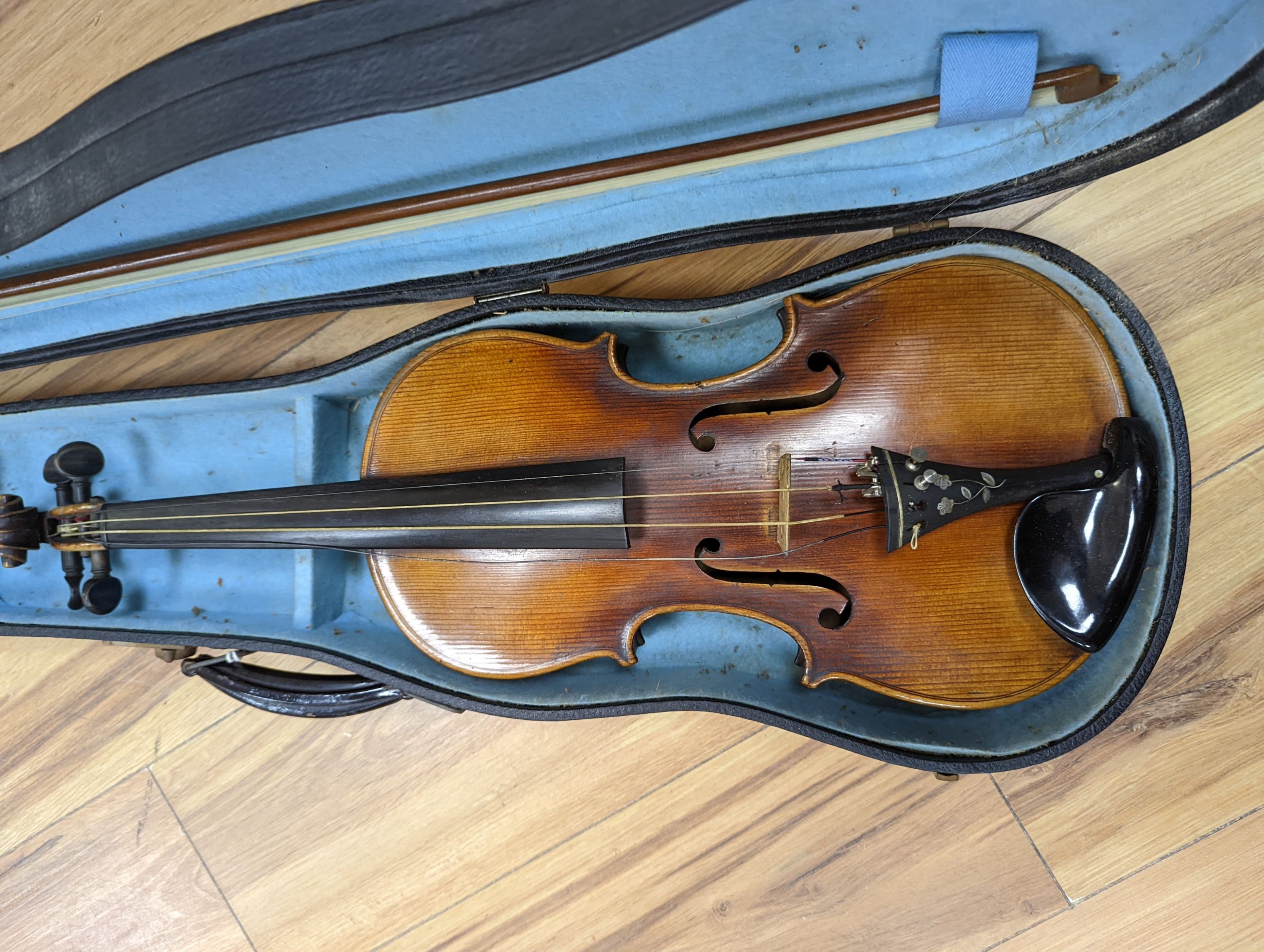 A late 19th century German violin, case, 60 cms long.